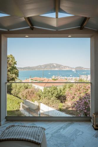 a large window in a room with a view of the ocean at Zante Sun Resort in Lithakia