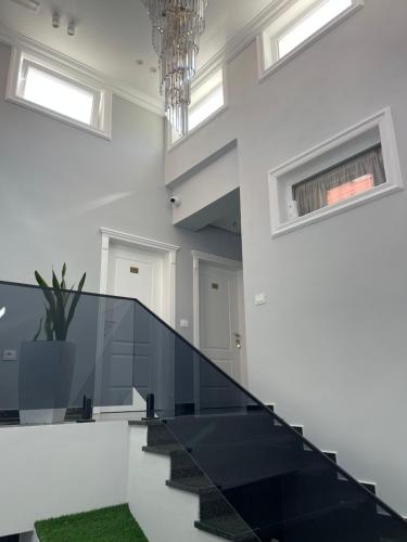 a staircase in a house with a glass floor at Stone Bazaar Villa in Krujë