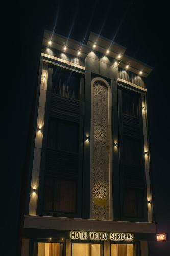 a hotel tower with lights on top of it at night at Hotel Vrinda Shridhar in Vrindāvan