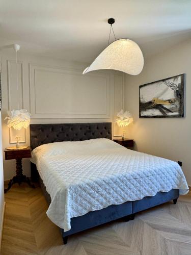 Ένα ή περισσότερα κρεβάτια σε δωμάτιο στο Ameli Heritage rooms & apartments