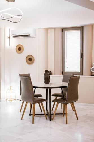 a dining room with a table and chairs at Zante Sun Resort in Lithakia