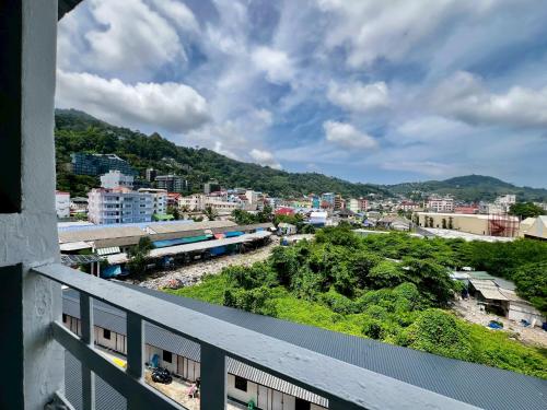 a view from a balcony of a city with a train at Mama's Cozy Studio - Patong Beach in Patong Beach