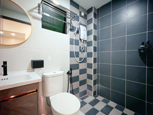 a bathroom with a toilet and a sink and a shower at Ipoh Manhattan Free Waterpark 3BR 8Pax Family Suite MHA308 by City Home Empire in Ipoh