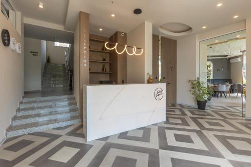 a lobby with a reception desk in a building at Hotel Sea Sand in Sveti Vlas