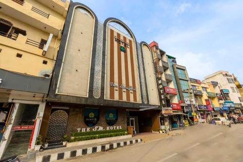 a group of buildings on a city street at The SM Hotel By RMR Hotels in New Delhi