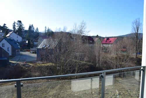 a view of a town with houses and trees at Sun View in Szklarska Poręba