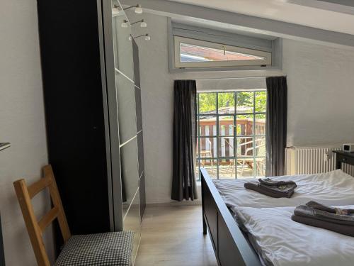 Ένα ή περισσότερα κρεβάτια σε δωμάτιο στο Auf den Höfen Fewo 13