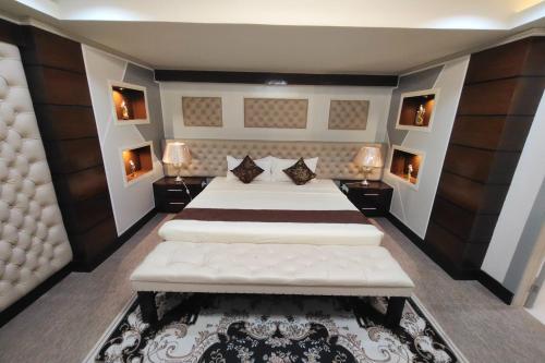 Ένα ή περισσότερα κρεβάτια σε δωμάτιο στο Bergamo Hotel Lingayen