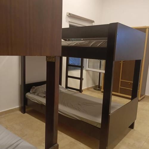 a couple of bunk beds in a room at Chalet Adam- Ajloun شاليه ادم in Ajloun
