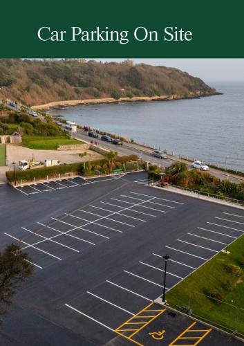 an empty parking lot next to the water at The Falmouth Hotel in Falmouth