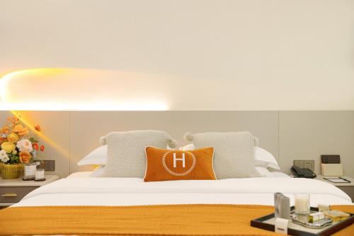 Katil atau katil-katil dalam bilik di Huanyi Hotel