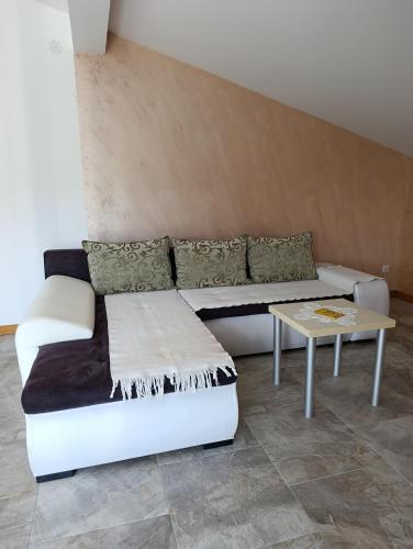 a living room with a couch and a table at Andjela LUX in Belgrade