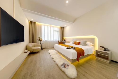 Katil atau katil-katil dalam bilik di Huanyi Hotel