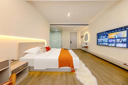 Katil atau katil-katil dalam bilik di Huanyi Hotel