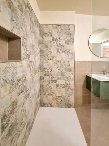 a bathroom with a sink and a mirror at Ai Parlenti 23 - day&night in Tirano