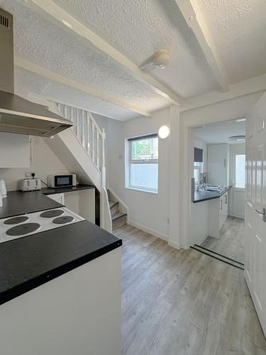 a kitchen with a stove and a counter top at York Road in Great Yarmouth