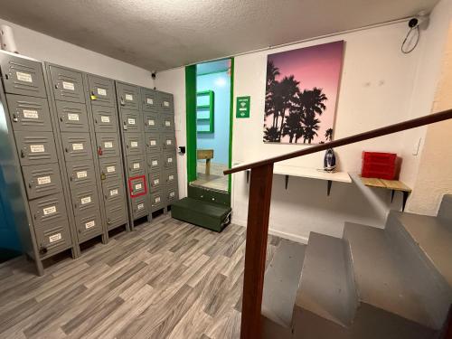 a bunch of lockers in a room with a staircase at OQP Vacations in Miami