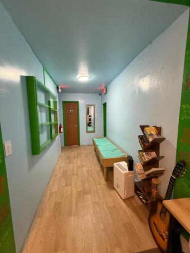 a room with a couch and a table and a guitar at OQP Vacations in Miami