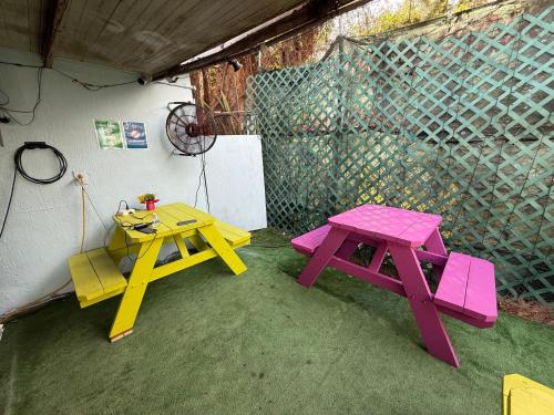 a picnic table and bench in a room at OQP Vacations in Miami