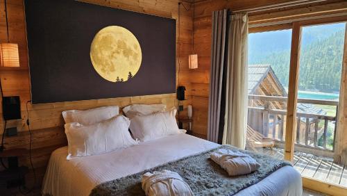 Katil atau katil-katil dalam bilik di Le Chalet Blanc Hôtel & Spa