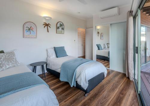 Ένα ή περισσότερα κρεβάτια σε δωμάτιο στο 3 Bedroom Villa, Great Views, Buggy Hamilton Island