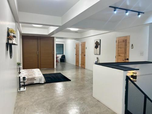 a large living room with a counter in the middle at Choose me guesthouse in Bang Kruai