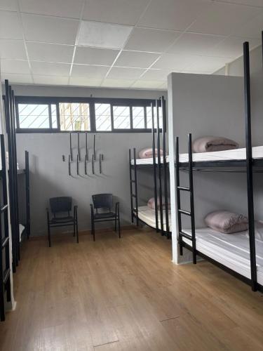 Ένα ή περισσότερα κρεβάτια σε δωμάτιο στο Hostel Azul Cielo