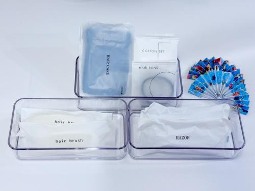 three clear containers sitting on top of a white table at つるのや鶴見105 in Yokohama