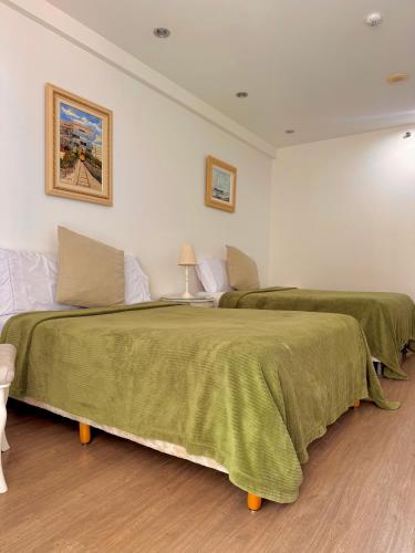 Ένα ή περισσότερα κρεβάτια σε δωμάτιο στο Loft vistamar business completo