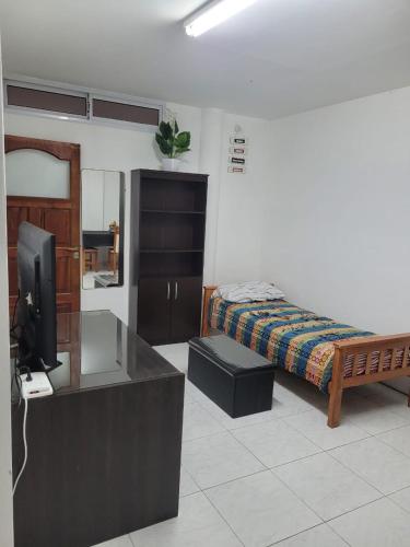 En eller flere senge i et værelse på Departamento pleno centro