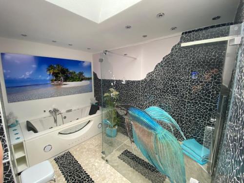 a bathroom with a shower and a sink and a tub at Wohlfühloase in Hofheim in Hofheim am Taunus
