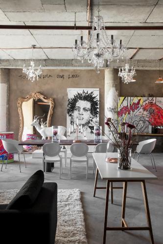 a dining room with a table and chairs at The Franklin Exclusive Suites in Johannesburg