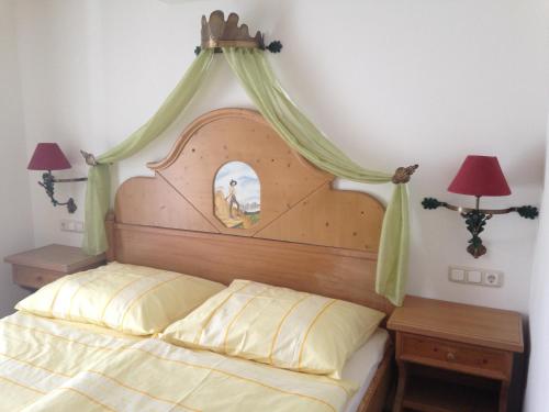 a bedroom with a bed with a canopy at Haus Julia in Mühlbach am Hochkönig