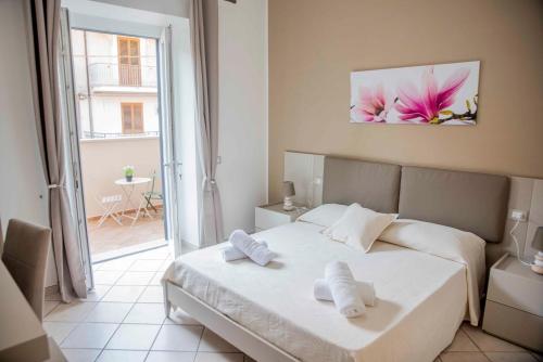 a bedroom with a bed with two towels on it at La Magnolia in Centola