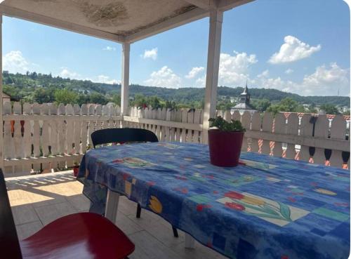 a table and chairs on a porch with a view at Weinsberger Kultur in Weinsberg