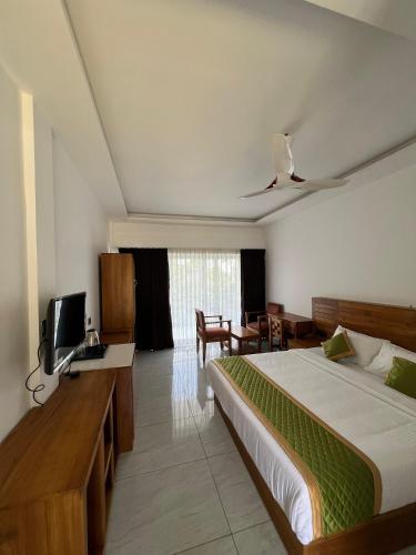 Postel nebo postele na pokoji v ubytování Zeezmount Resorts & Spa Munnar