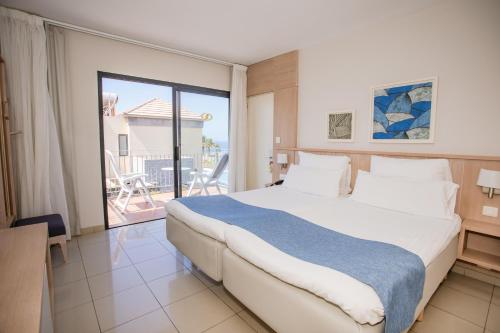 Ένα ή περισσότερα κρεβάτια σε δωμάτιο στο Caybeach Meloneras