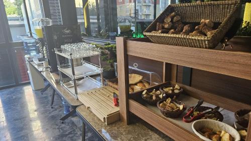 a shelf with a bunch of food in a store at Educity Suite and Hotels Atasehir in Istanbul