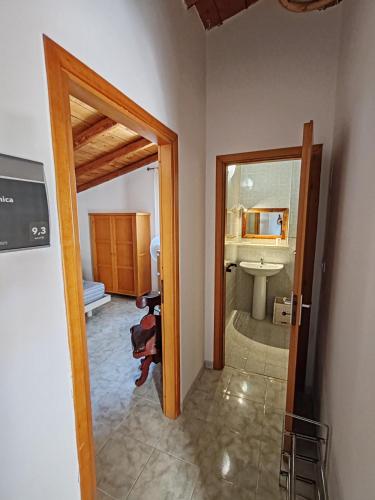 a bathroom with a sink and a toilet and a mirror at Dimora Veronica in Terrauzza