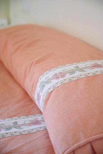 a close up of a pillow on a bed at Hotel Paraíso in Lanjarón