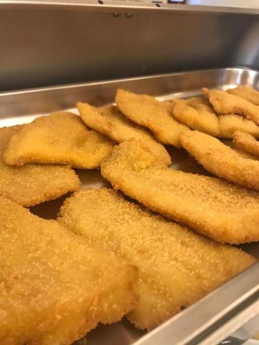 a tray of fried food in a pan at Park Hotel Villa Americana in Rodi Garganico
