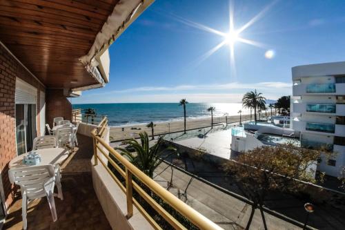 a balcony with a view of the beach at Apartamentos Marina sol de España in Cambrils