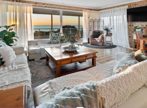 a living room with a couch and a table at Pet-Friendly Beachfront Family Dog Bch in Mandurah
