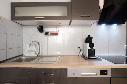 a kitchen with a sink and a counter top at Ferreira's Ferienwohnung in St. Blasien