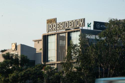 a building with a sign on top of it at J R Residency in Navi Mumbai
