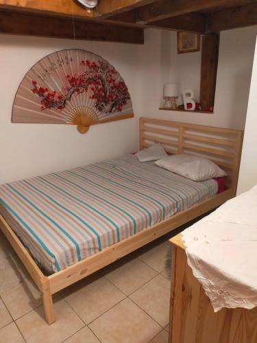 a bedroom with a bed in a room at loft indipendente con giardino a Roma Tor vergata in Rome