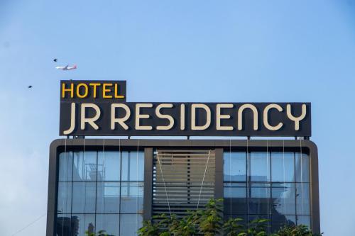 a sign on the top of a hotel headquarters at J R Residency in Navi Mumbai