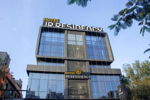 a building with a sign on top of it at J R Residency in Navi Mumbai