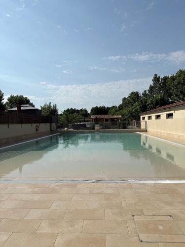 a large pool of water in a courtyard at Camping Bungalow el Llac de Banyoles in Porqueres