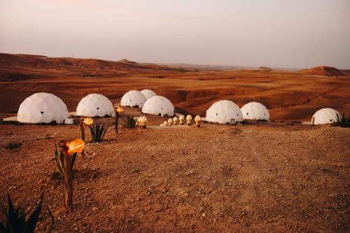 a group of domes in the middle of a desert at Agafay Desert in El Karia